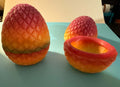 Small 3D printed dragon egg storage box with fire gradient scales, shown open and closed