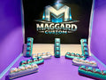 3D printed mechanical keyboard fidget clicker set with pillow-top keycaps in holographic teal and silver finish displayed in front of Maggard Custom logo
