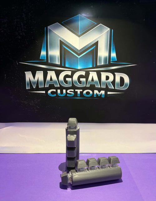 3D printed 5-key mechanical clicker fidget toy in gray with keycap-style buttons on a compact base displayed in front of Maggard Custom logo