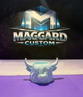 3D printed mint green highland cow head planter and trinket holder displayed in front of Maggard Custom logo