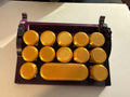 Fidget keyboard clicker and desk organizer in gold and dark purple 3D printed