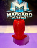 3D printed red web slinger hero mask pen holder and desk organizer with detailed web texture displayed in front of Maggard Custom logo